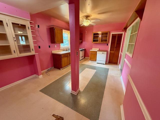 215 Bellevue Ave, Wilmore, KY 40390 - kitchen featuring white appliances, brown cabinetry, ceiling fan, light flooring, and light countertops