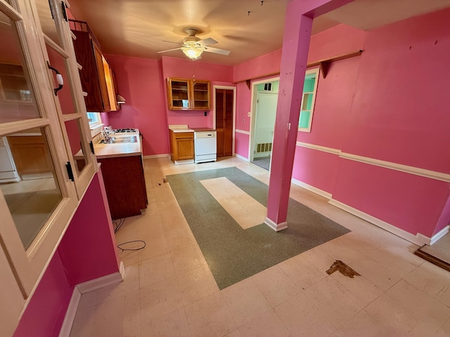 215 Bellevue Ave, Wilmore, KY 40390 - kitchen featuring light countertops, ceiling fan, glass insert cabinets, brown cabinets, and light floors