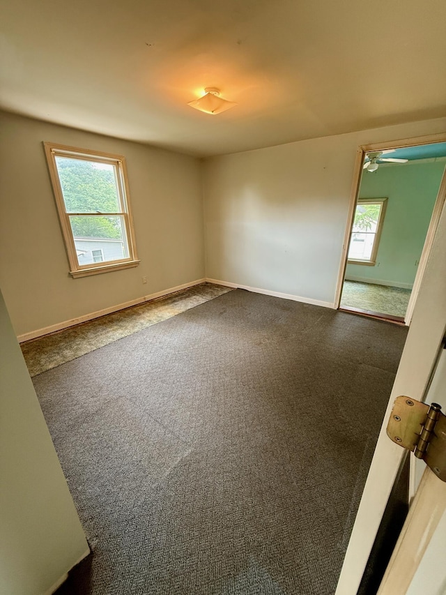215 Bellevue Ave, Wilmore, KY 40390 - carpeted empty room featuring plenty of natural light