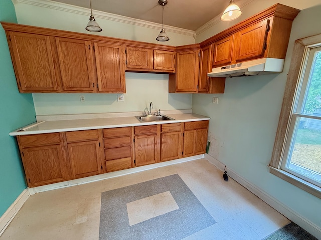 215 Bellevue Ave, Wilmore, KY 40390 - kitchen featuring under cabinet range hood, brown cabinets, pendant lighting, ornamental molding, and light flooring