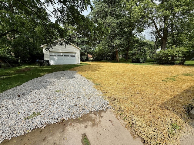 215 Bellevue Ave, Wilmore, KY 40390 - view of green lawn featuring a detached garage, an outbuilding, and view of scattered trees