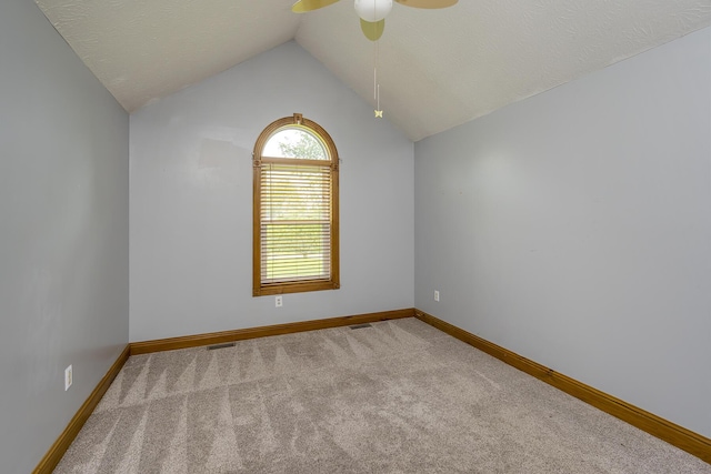 1324 Travis Dr, Richmond, KY 40475 - unfurnished room with vaulted ceiling, baseboards, ceiling fan, carpet, and a textured ceiling