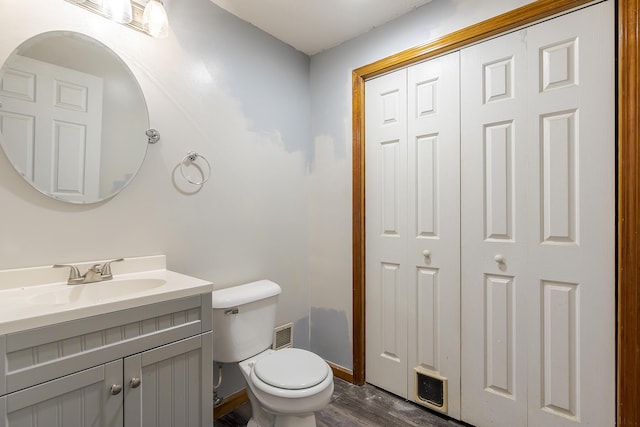 1324 Travis Dr, Richmond, KY 40475 - bathroom with toilet, vanity, wood finished floors, and baseboards