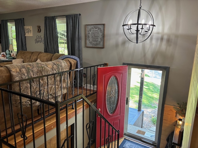 1512 Maple Ln, Corbin, KY 40701 - foyer entrance featuring a chandelier and a textured ceiling