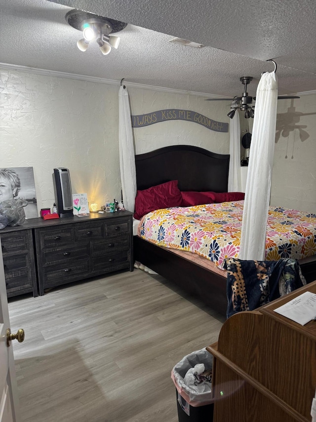 1512 Maple Ln, Corbin, KY 40701 - bedroom with a textured wall, a textured ceiling, and wood finished floors