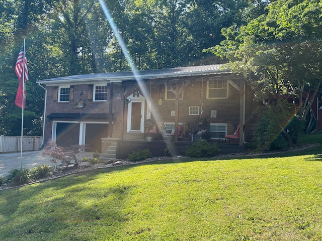 1512 Maple Ln, Corbin, KY 40701 - view of front of property with an attached garage, brick siding, and driveway