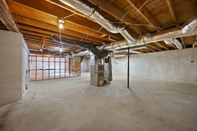 141 Springfield Dr, Corbin, KY 40701 - unfinished below grade area featuring heating unit and concrete block wall