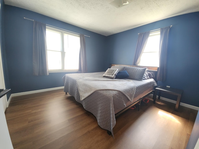 50 Ford Dr, Mount Vernon, KY 40456 - bedroom featuring wood finished floors, a textured ceiling, and baseboards