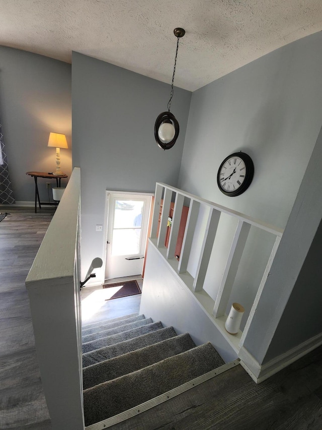 50 Ford Dr, Mount Vernon, KY 40456 - stairs featuring a textured ceiling and wood finished floors