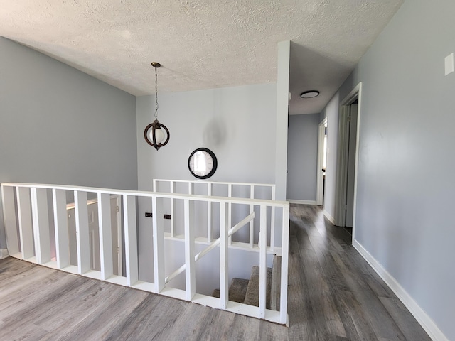 50 Ford Dr, Mount Vernon, KY 40456 - corridor featuring dark wood-style floors, a textured ceiling, and baseboards