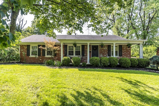 3506 Newport Dr, Lexington, KY 40517 - ranch-style house featuring a front lawn, brick siding, and a porch