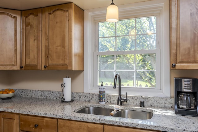 3506 Newport Dr, Lexington, KY 40517 - kitchen featuring a sink, light stone counters, and brown cabinets