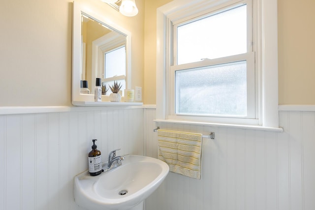 3506 Newport Dr, Lexington, KY 40517 - bathroom with wainscoting, a sink, and a decorative wall