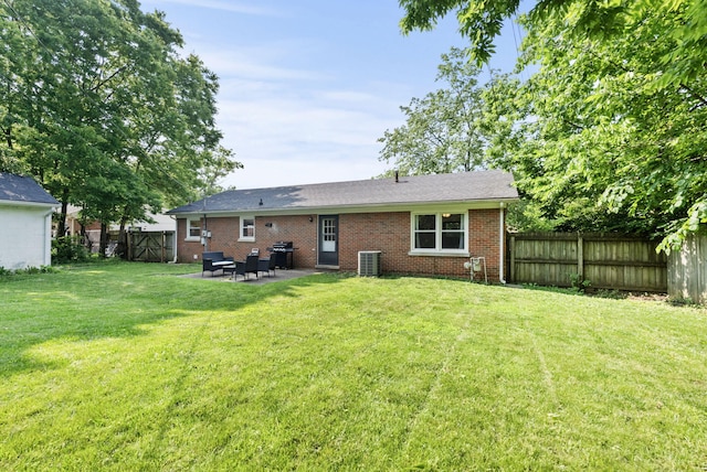 103 Cypress St, Nicholasville, KY 40356 - rear view of property with a patio area, brick siding, and cooling unit