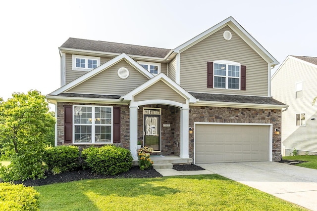 162 Johnstone Trl, Georgetown, KY 40324 - view of front of home with a garage, a front lawn, driveway, stone siding, and a shingled roof