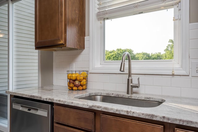 162 Johnstone Trl, Georgetown, KY 40324 - kitchen with a sink, stainless steel dishwasher, decorative backsplash, and light stone counters