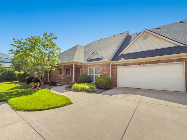 2625 Flying Ebony Dr, Lexington, KY 40509 - view of front of home with brick siding, a shingled roof, and driveway