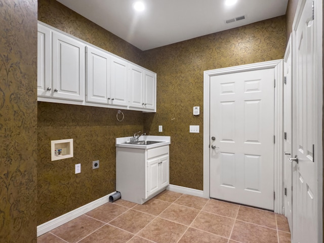 2625 Flying Ebony Dr, Lexington, KY 40509 - laundry room with electric dryer hookup, hookup for a washing machine, cabinet space, light tile patterned floors, and baseboards