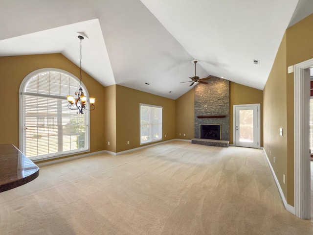 2625 Flying Ebony Dr, Lexington, KY 40509 - unfurnished living room with lofted ceiling, ceiling fan, light colored carpet, a chandelier, and a stone fireplace