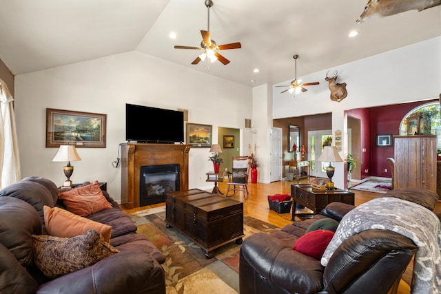 204 Keith Dr, Berea, KY 40403 - living area featuring ceiling fan, a glass covered fireplace, wood finished floors, recessed lighting, and high vaulted ceiling