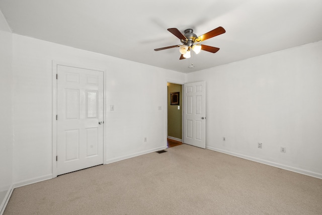 204 Keith Dr, Berea, KY 40403 - unfurnished bedroom featuring light colored carpet, baseboards, and ceiling fan