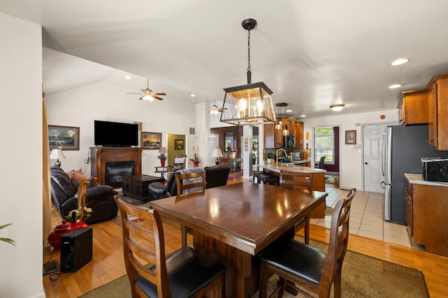 204 Keith Dr, Berea, KY 40403 - dining area featuring a fireplace, light wood finished floors, a ceiling fan, recessed lighting, and vaulted ceiling