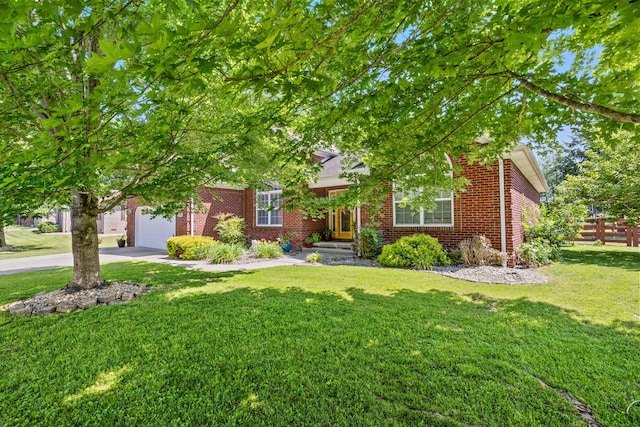 204 Keith Dr, Berea, KY 40403 - view of property hidden behind natural elements featuring brick siding, an attached garage, and concrete driveway