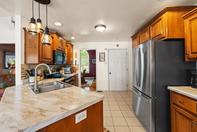 204 Keith Dr, Berea, KY 40403 - kitchen with appliances with stainless steel finishes, a sink, light countertops, brown cabinets, and recessed lighting