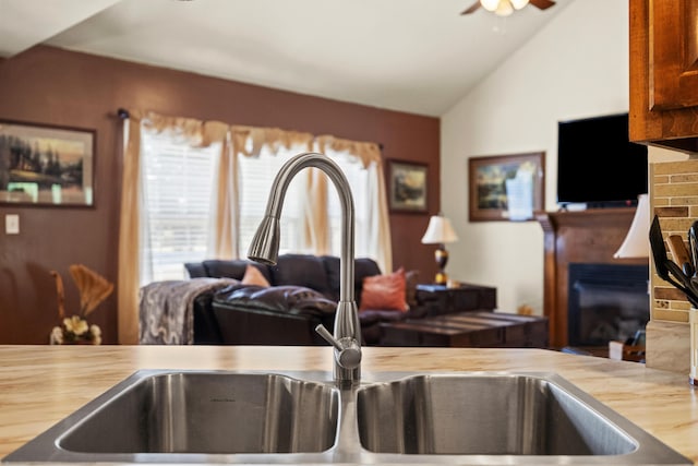 204 Keith Dr, Berea, KY 40403 - detailed view of a glass covered fireplace, a sink, and a ceiling fan