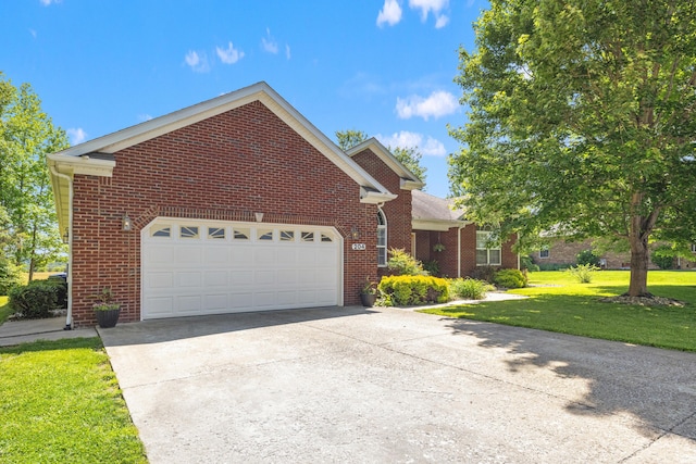 204 Keith Dr, Berea, KY 40403 - view of front of home with brick siding, a front lawn, driveway, and a garage