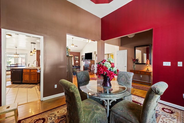 204 Keith Dr, Berea, KY 40403 - dining room featuring a high ceiling, baseboards, light wood-style floors, and a ceiling fan