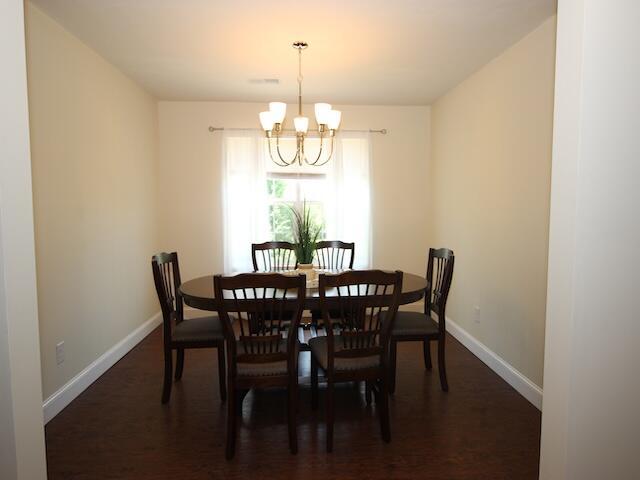 91 Graysons Way, Somerset, KY 42503 - dining area with a chandelier, baseboards, and dark wood-style floors