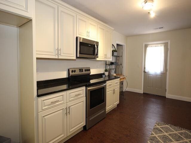 91 Graysons Way, Somerset, KY 42503 - kitchen featuring stainless steel appliances, dark countertops, baseboards, white cabinets, and dark wood-style floors