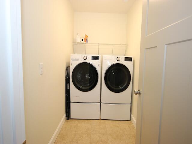 91 Graysons Way, Somerset, KY 42503 - washroom with washer and clothes dryer, baseboards, and light tile patterned flooring