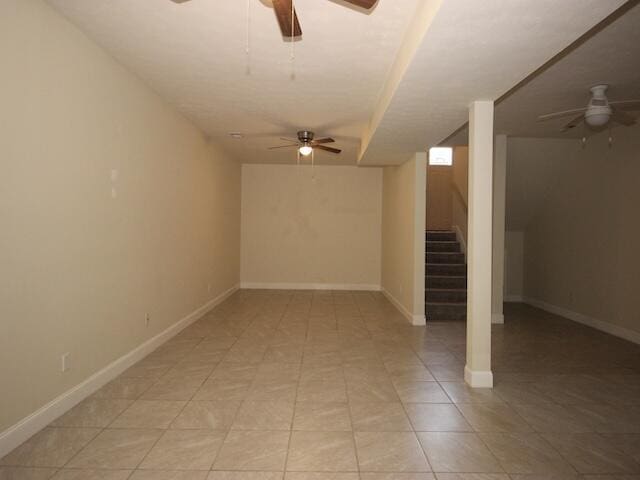 91 Graysons Way, Somerset, KY 42503 - finished below grade area with a ceiling fan, stairway, baseboards, and light tile patterned floors