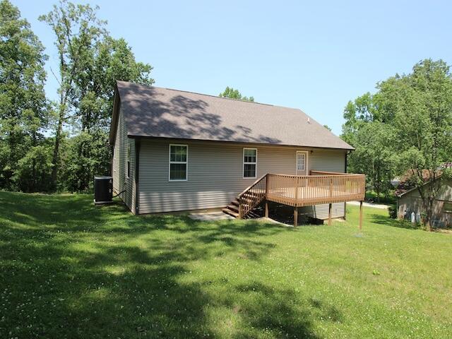 91 Graysons Way, Somerset, KY 42503 - back of house with a wooden deck, a lawn, and central air condition unit