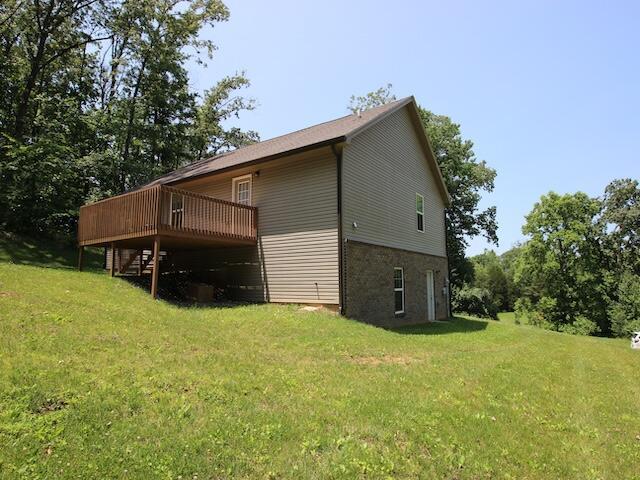 91 Graysons Way, Somerset, KY 42503 - view of side of home featuring a deck and a lawn