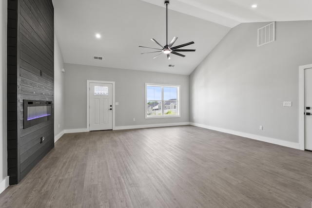 202 Max Cavnes Rd, Danville, KY 40422 - unfurnished living room featuring a ceiling fan, a fireplace, high vaulted ceiling, wood finished floors, and recessed lighting