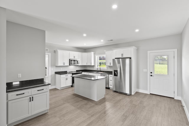 202 Max Cavnes Rd, Danville, KY 40422 - kitchen featuring stainless steel appliances, dark countertops, light wood-style floors, white cabinetry, and recessed lighting
