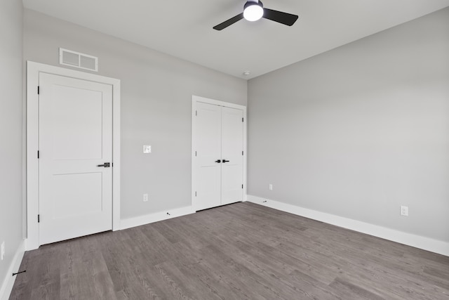202 Max Cavnes Rd, Danville, KY 40422 - unfurnished bedroom with wood finished floors, a closet, and a ceiling fan