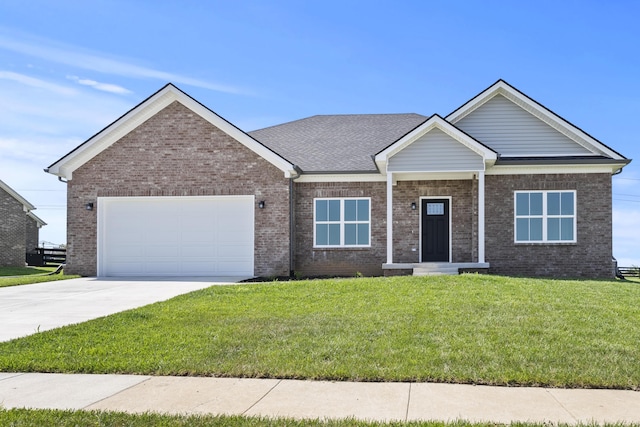 202 Max Cavnes Rd, Danville, KY 40422 - view of front of house featuring a garage, concrete driveway, a front lawn, and brick siding