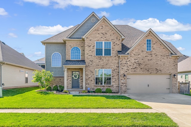 110 Kinglet Pt, Nicholasville, KY 40356 - view of front facade featuring driveway, a garage, brick siding, and roof with shingles