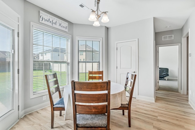 110 Kinglet Pt, Nicholasville, KY 40356 - dining room with a chandelier, light wood-style flooring, and baseboards