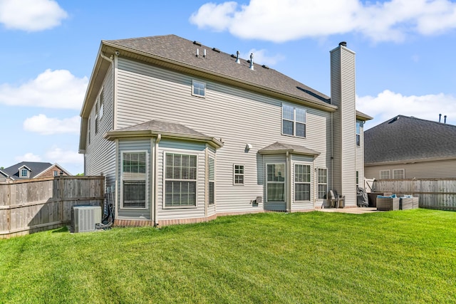 110 Kinglet Pt, Nicholasville, KY 40356 - rear view of house featuring central AC, a chimney, outdoor lounge area, and a patio area