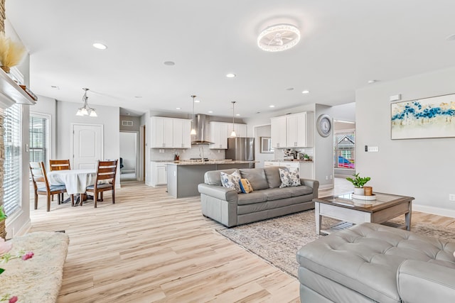 110 Kinglet Pt, Nicholasville, KY 40356 - living room with healthy amount of natural light, light wood-style floors, recessed lighting, and baseboards