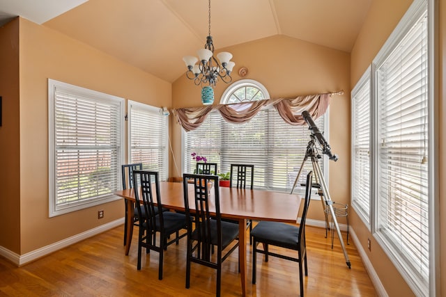 988 Fiddler Creek Way, Lexington, KY 40515 - dining room with vaulted ceiling, a chandelier, light wood finished floors, and healthy amount of natural light