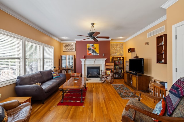 988 Fiddler Creek Way, Lexington, KY 40515 - living room with a ceiling fan, crown molding, a fireplace with flush hearth, and light wood-type flooring