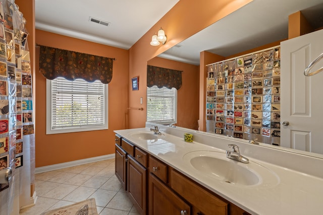 988 Fiddler Creek Way, Lexington, KY 40515 - full bathroom featuring double vanity, tile patterned floors, and baseboards