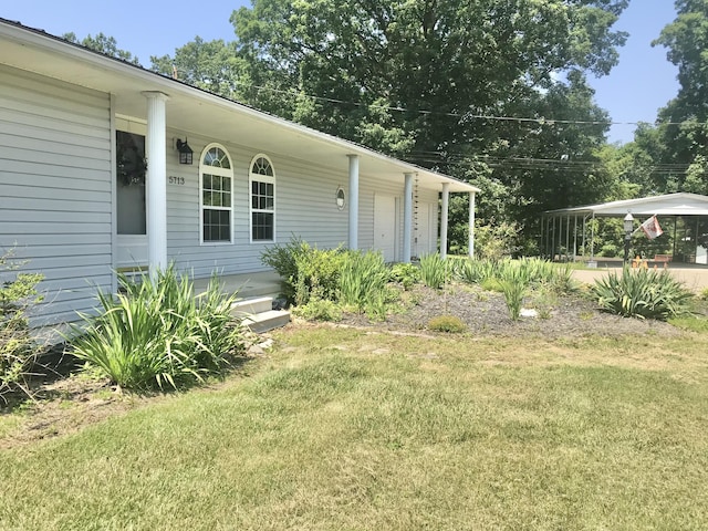5713 Bybee Rd, Ashland, KY 41102 - view of exterior entry with a yard and covered porch