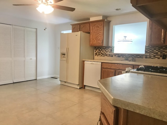 5713 Bybee Rd, Ashland, KY 41102 - kitchen featuring white appliances, tasteful backsplash, a ceiling fan, and light tile patterned floors